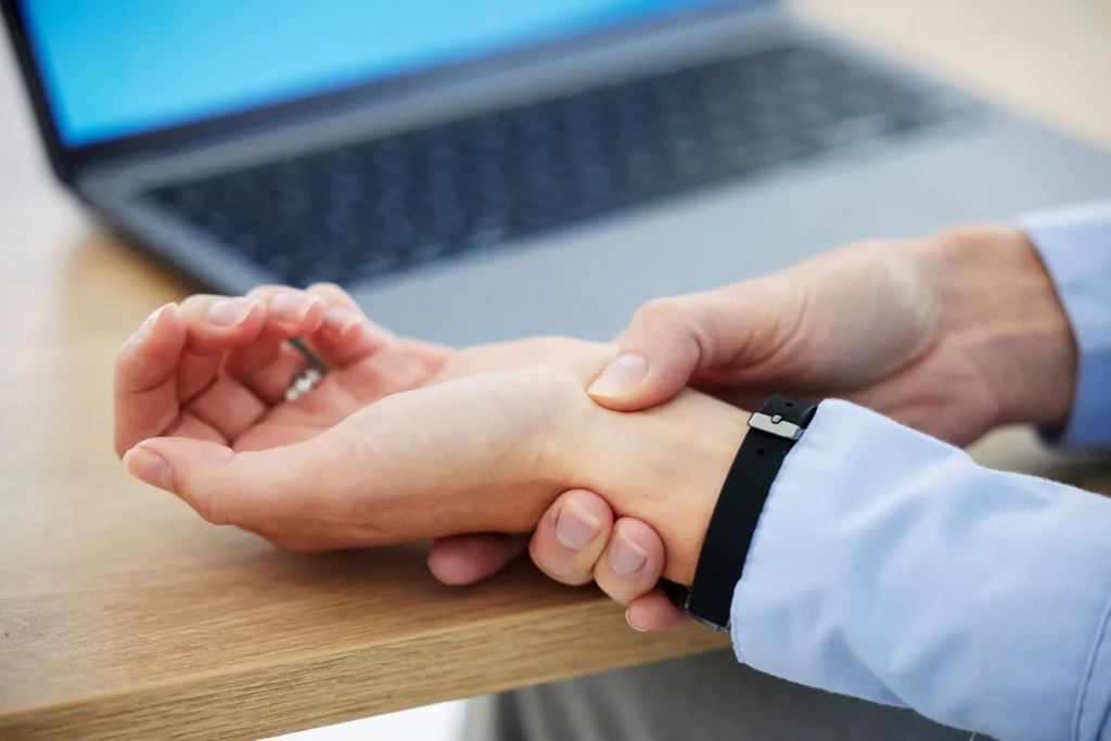 businesswoman wrist cramp woman touching her wris 2023 11 27 05 12 07 utc